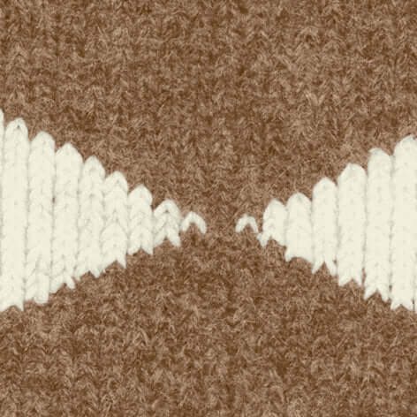 Textuur van gebreide wolmix in een bruin en wit patroon, perfect voor Burlington Huissokken Argyle Dames 22131 5078 almond.