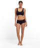 Model wearing FALKE 2-Pack Bustier Daily Comfort in black, showcasing comfort and style.