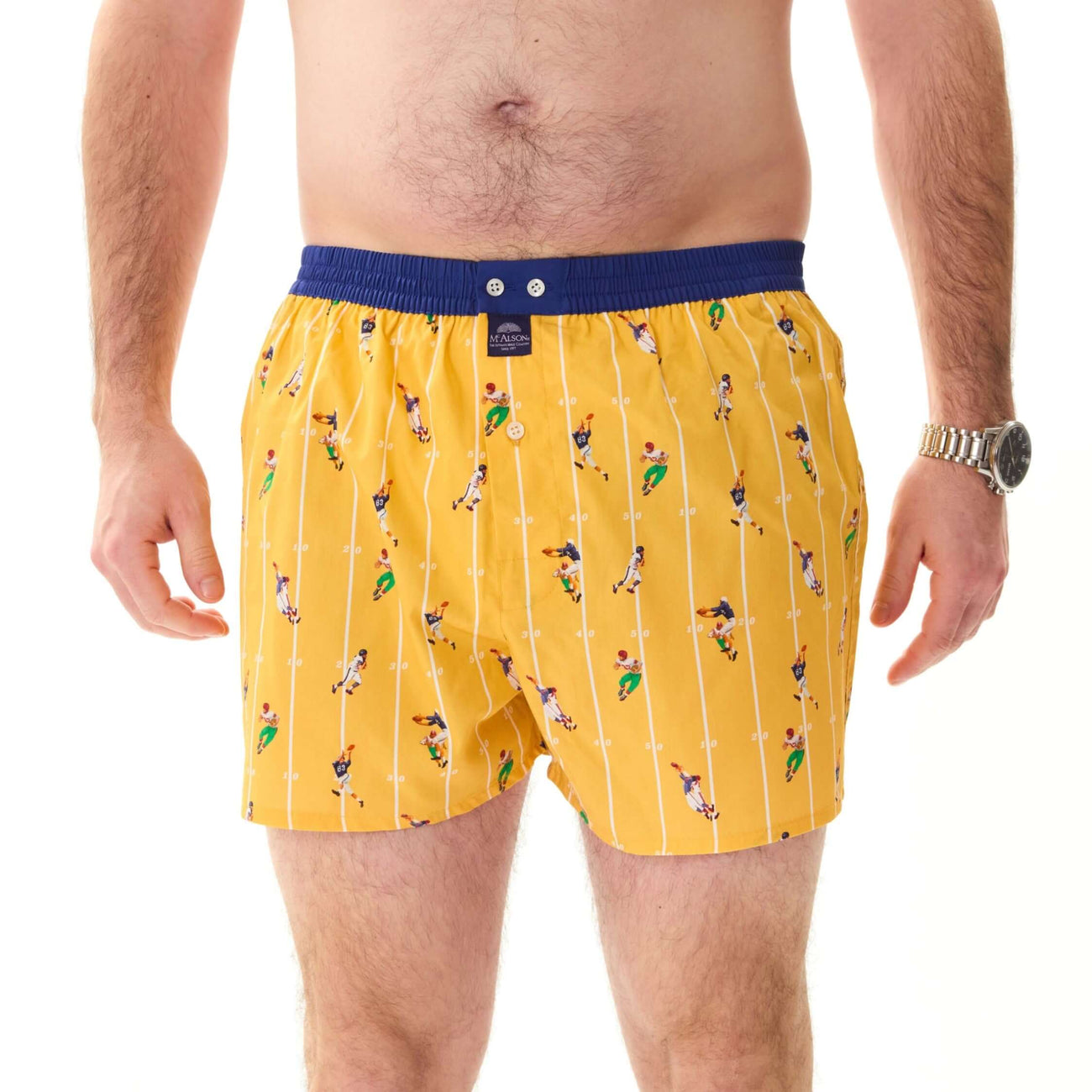 McAlson Boxershort met binnenbroek American Football yellow M5267, gele boxer met American Football print en donkerblauwe boord.