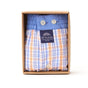 McAlson Boxershort in blauw-oranje ruitjesprint, ingepakt in een luxe doos, met zichtbare label.