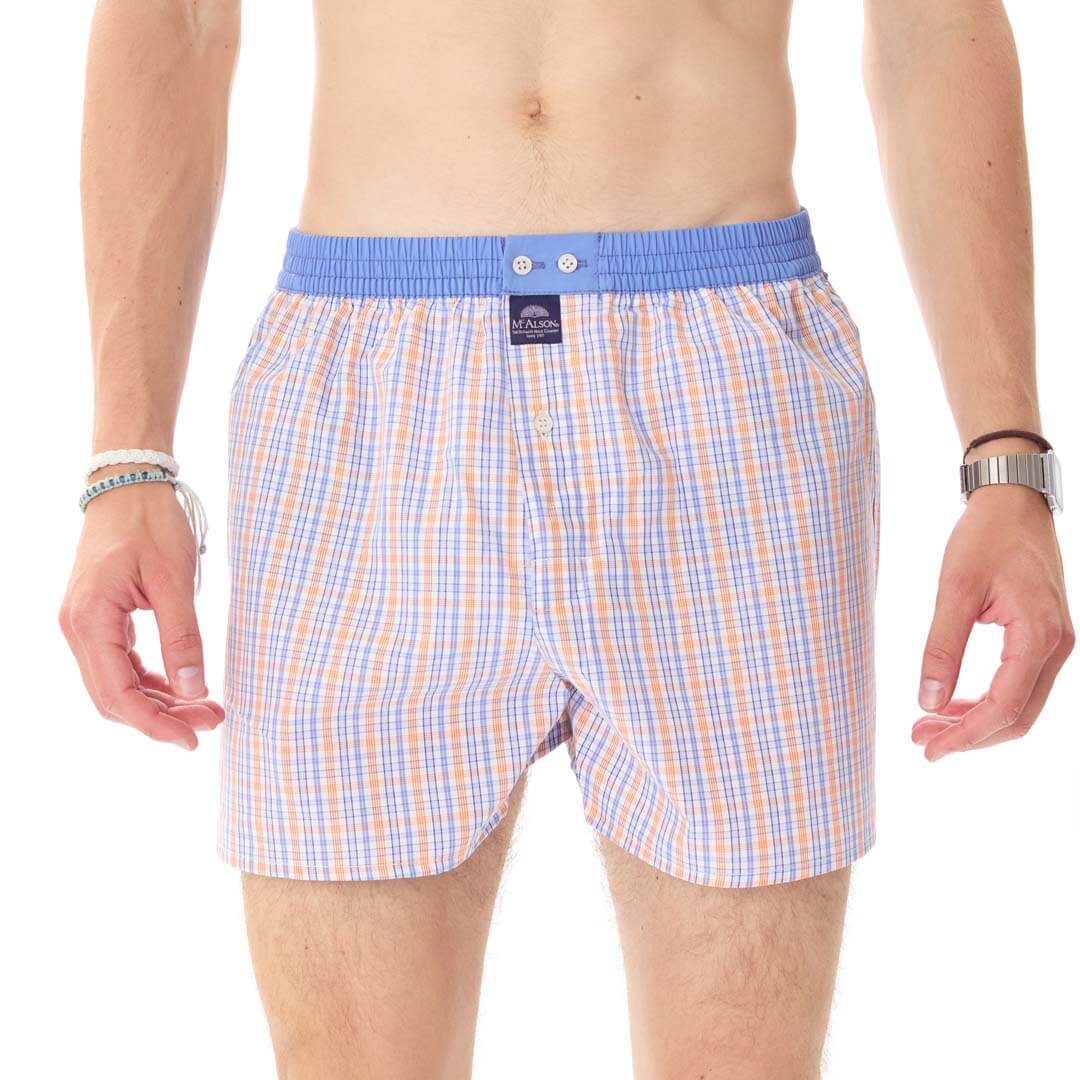 Blauw oranje wijde boxer met ruitjesprint en blauwe boord, voor stijl en comfort.