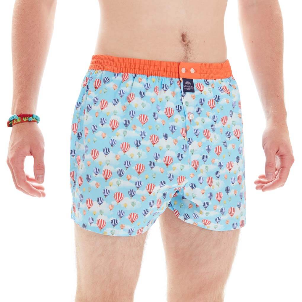 Mc Alson boxershort met luchtballonnen op blauwe achtergrond en oranje tailleband.