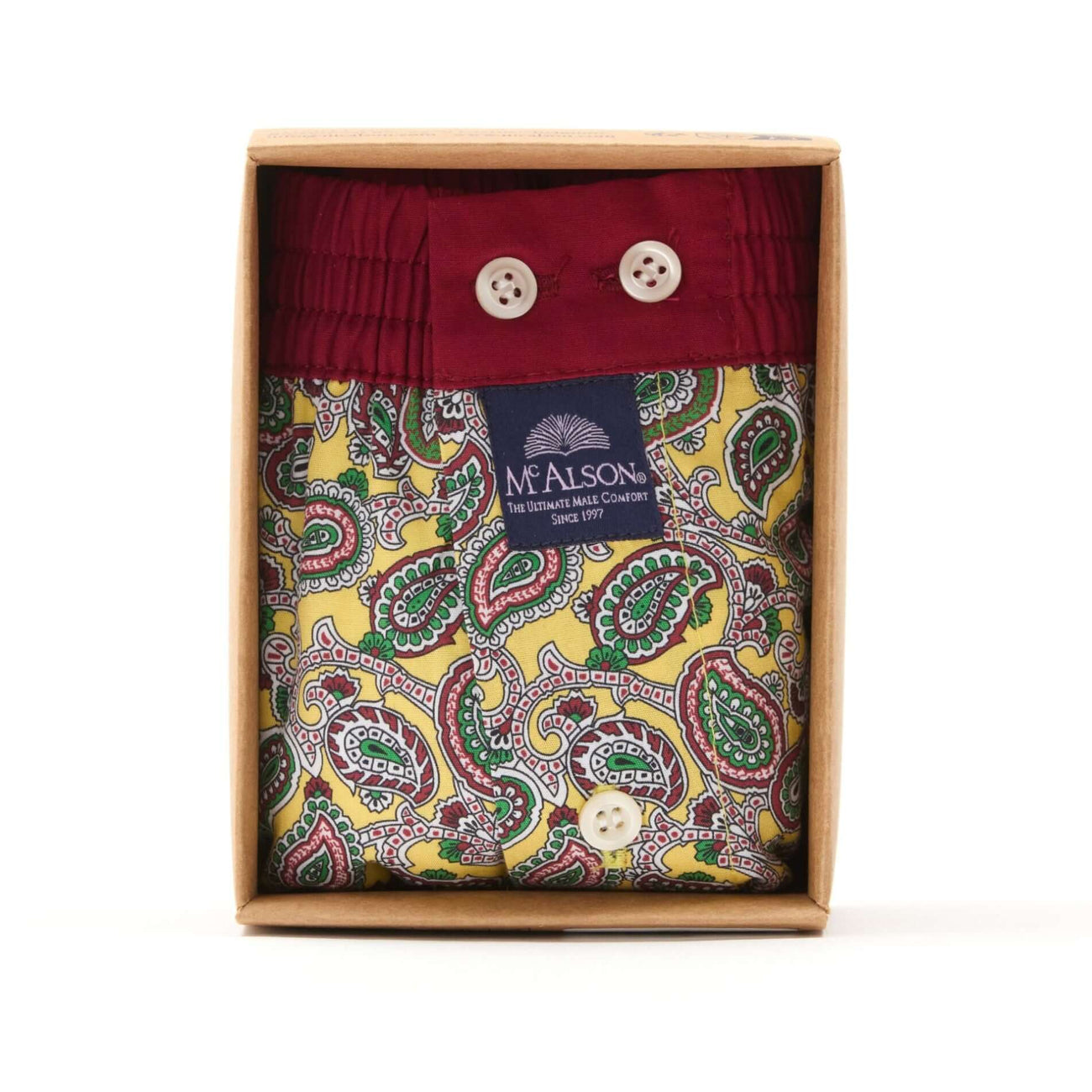 McAlson gele boxershort met paisleyprint in verpakking met donkerrode boord en knopen.