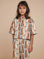 Snurk Bowie Cropped T-Shirt Kids: leuk cropped shirt met kattenprint voor kinderen, perfect voor speel- of bedtijd.