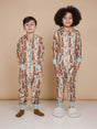 Kinderen in SNURK Bowie Onesie Kids met schattige kattenprint en comfortabele hoody.