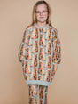 SNURK Bowie Sweater Dress Kids worn by a girl with cat print and matching leggings, perfect for comfort and chilling.