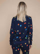 SNURK Building Blocks Sweater Dames met kleurrijke blokken op een navy achtergrond.