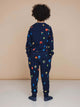 A child wearing the SNURK Building Blocks Sweater Kids, featuring a colorful block print on a dark blue background.