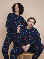 SNURK Building Blocks Sweater Unisex worn by models, featuring colorful blocks on a navy background.