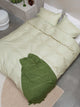 SNURK Check Green Beige dekbedovertrek in groen en beige geruit design, gemaakt van 100% biologisch katoen.
