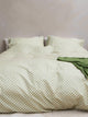 SNURK Check Green Beige dekbedovertrek met ruitpatroon op bedspread