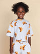 SNURK Croissants Cropped T-Shirt Kids met vrolijke croissantjes, perfect voor kinderen die van comfort houden.