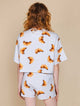 SNURK Croissants Shorts Dames met croissantjesprint op een luchtige korte broek achteraan.