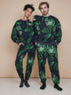 SNURK Dark Forest Broek Relaxed Unisex, unisex joggers with green leaf print on a dark background, stylish and comfortable.