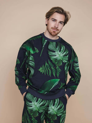 SNURK Dark Forest Sweater Heren met grote donkergroene bladeren op een antracietgrijze achtergrond.