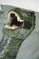 SNURK Dino Green dekbedovertrek met een T-Rex ontwerp op kussen in groene kleur.