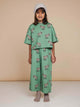 SNURK Donkeys Cropped T-Shirt Kids model wearing a green cropped t-shirt and matching pants with cute donkey print.