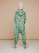 A child wearing a SNURK Donkeys Onesie Kids in a fun green color, showcasing adorable donkey prints.