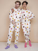 SNURK Donuts Sweater Unisex modelled by couple in colorful donut print on beige background.