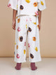 SNURK Donuts Wijde Broek Kids met kleurrijke donutprint op een beige achtergrond voor kinderen.