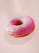 Afbeelding van een roze donut met sprinkles, onderdeel van het SNURK Donuts dekbedovertrek.