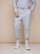 SNURK Grey Broek Regular Unisex, lichtgrijze joggingsbroek voor dames en heren, comfortabel en veelzijdig.