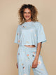SNURK Hopeless Romantic Cropped T-Shirt Dames met leuke bloemetjesprint in zachte katoen.