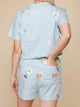 SNURK Hopeless Romantic Shorts Dames met bloemenprint en handige zakken op een luchtige achtergrond.