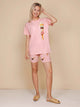 SNURK Ice Cream Cones Bikershorts Women in pink outfit with ice cream print, perfect for summer comfort.