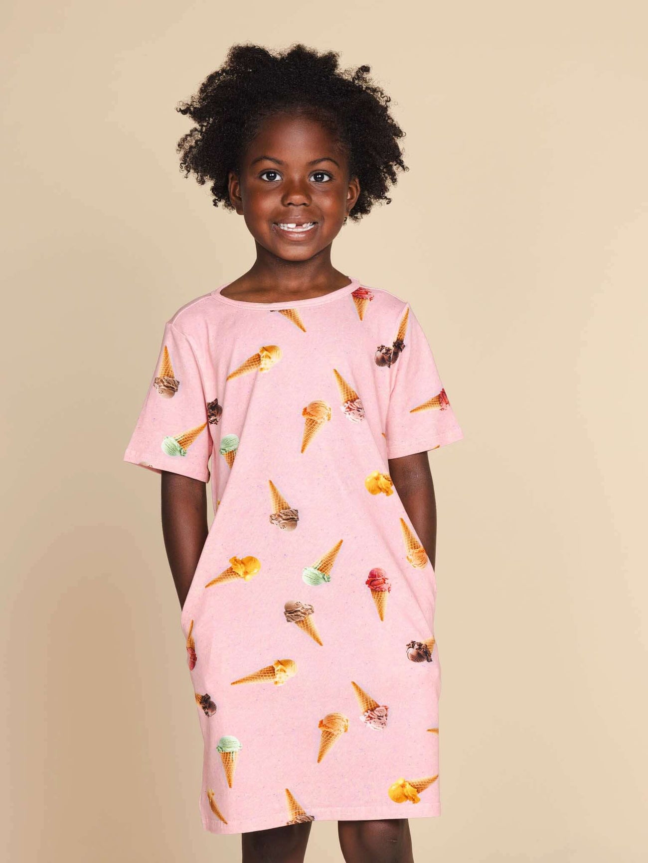 SNURK Ice Cream Cones T-shirt Dress Kids in pink with ice cream cone pattern, perfect for warm weather.