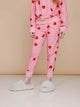SNURK Lollipop Love Broek Kids met felrode hartjeslollies op roze, perfect voor meiden!