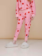 SNURK Lollipop Love Broek Kids met felrode hartjeslollies op roze, perfect voor meiden!