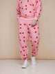 SNURK Lollipop Love Broek Relaxed Unisex in roze met hartjeslollies, perfect voor comfort en stijl.