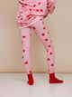 SNURK Lollipop Love Legging Dames met felrode hartjeslollies op roze, perfect voor dag en nacht.