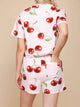 Achteraanzicht van SNURK Mon Cherry Shorts Dames, met rode kersjes op een lichte achtergrond.