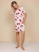 SNURK Mon Cherry T-shirt Dress Dames in lichtroze met kersenprint en praktische zakken, perfect voor casual dagen.