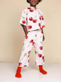 SNURK Mon Cherry Wide Pants Kids op een kind, vrolijke kersenprint met wijde pijpen en comfortabele pasvorm.
