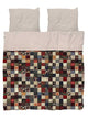 SNURK Quilty Pleasure dekbedovertrek met kleurrijk patchwork design en lichte kussenslopen voor een vrolijke slaapkamer.