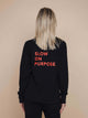 SNURK Slow Black Sweater Dames met teksten 'SLOW ON PURPOSE' op de rug, perfect voor relaxdagen.