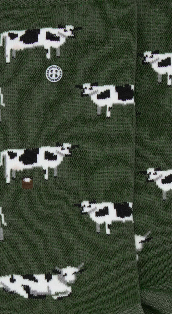Groene Alfredo Gonzales sokken met zwart-witte koeienprint, gemaakt van katoenmix met Polyamide en Elastaan, stijlvol en duurzaam.